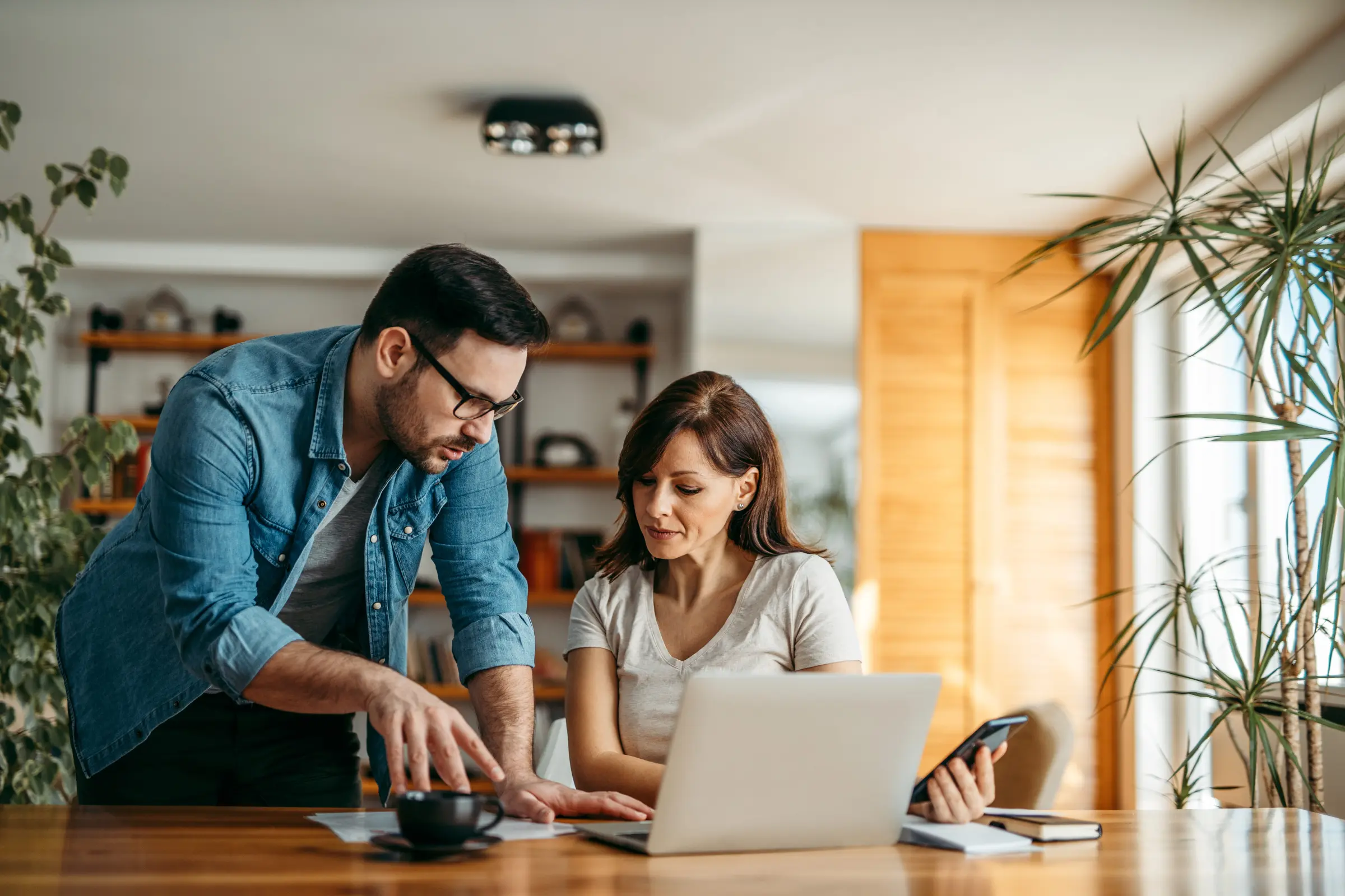 Two people discussing paperwork and working on a l 2023 11 27 05 35 44 utc 1